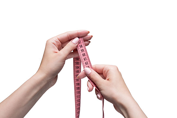 tape-female-hands-gray-space-weight-loss-diet Size measurement